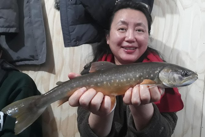 Fairbanks Ice Fishing Expedition in a Heated Cabin with Fish Cookout - Reindeer sausage, hot cocoa, and fresh fish