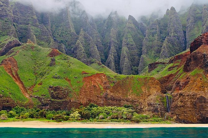 Kauai: Nā Pali Coast Zodiac Raft Expedition and Snorkeling - Sea caves and waterfalls along Nā Pali