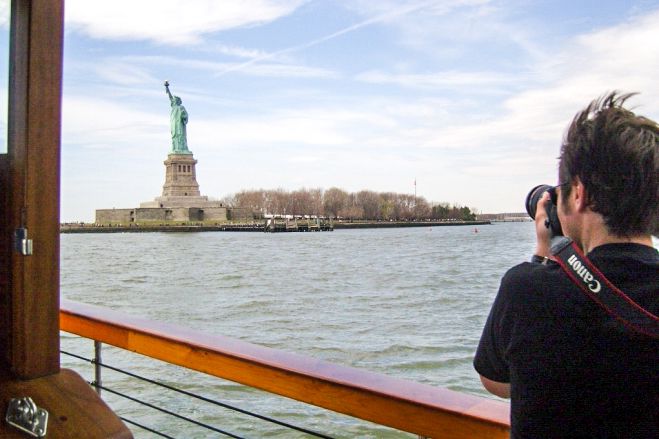 Manhattan: Statue and Skyline Cruise Aboard a Luxury Yacht - Statue of Liberty and Ellis Island from the water