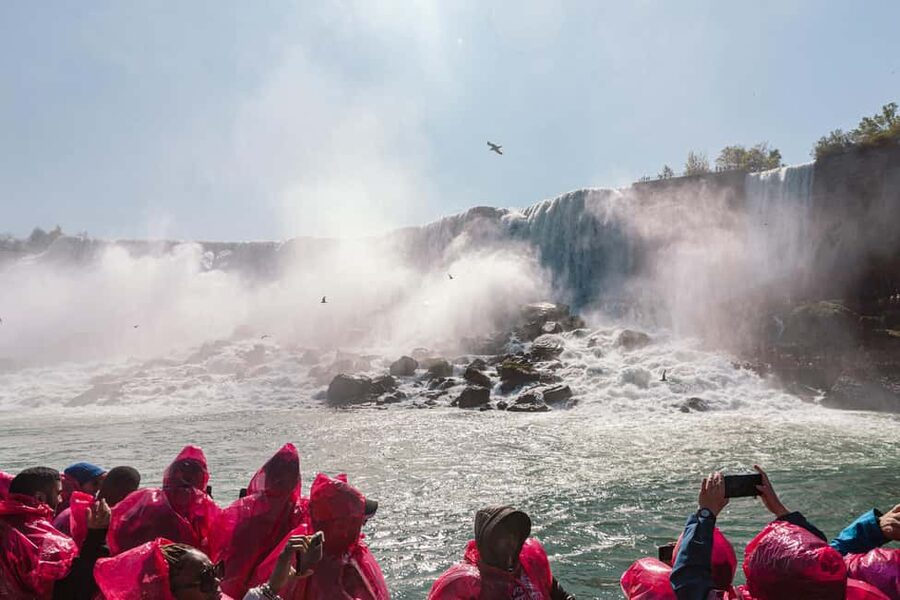 Niagara Falls, Canada: First Boat Cruise & Behind Falls Tour - What you get for $116