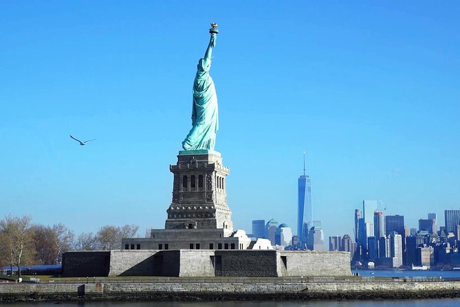 NYC in a Day Tour: Statue of Liberty, Times Square and More - Starting beneath the George M. Cohan statue in Times Square