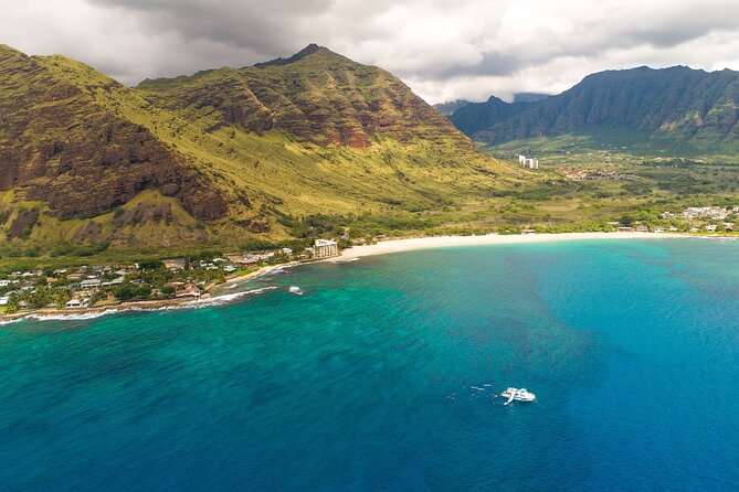 Oahu Dolphin and Snorkel Tour with Waikiki Pickup & Lunch - The slide, kayaks, paddle boards, and hula